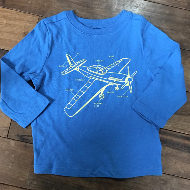 Old Navy(オールドネイビー)のオールドネイビー 長袖Tシャツ ブルー 飛行機柄 12-18M キッズ/ベビー/マタニティのベビー服(~85cm)(Ｔシャツ)の商品写真