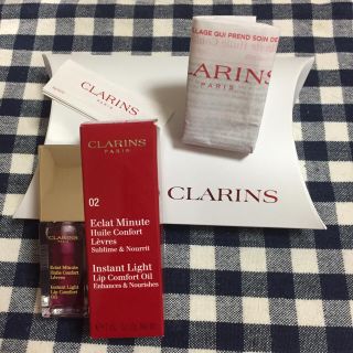 クラランス(CLARINS)の【新品】箱、袋付きCLARINS リップオイル02(リップグロス)