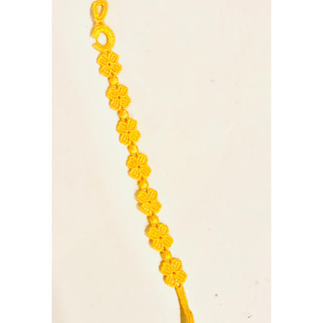 Cruciani(クルチアーニ)のCruciani クルチアーニ ミサンガブレスレット イエロー 黄色 レディースのアクセサリー(ブレスレット/バングル)の商品写真