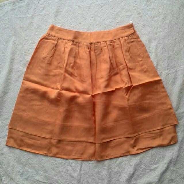 kumikyoku（組曲）(クミキョク)の組曲　KUMIKYOKU　スカート　オレンジ　タグ付き新品未使用品 レディースのスカート(ミニスカート)の商品写真