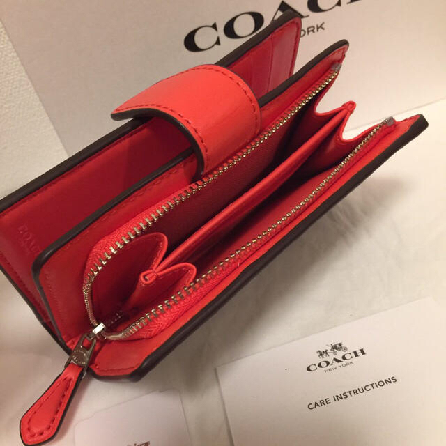 COACH(コーチ)のCOACH コーチ ブライトオレンジ シグネチャー カーキ 二つ折り財布 レディースのファッション小物(財布)の商品写真