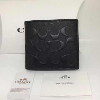 コーチ(COACH)のCOACH コーチ メンズ ブラック シグネチャーエンボス 折り財布 黒(折り財布)