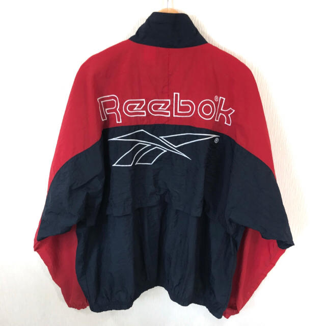 Reebok(リーボック)のバイカラー ビッグロゴ ♪ 90s リーボック ナイロンジャケット L 赤 紺 メンズのジャケット/アウター(ナイロンジャケット)の商品写真