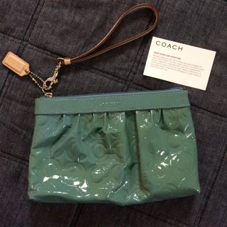 コーチ(COACH)のおーけい様専用です。COACH コーチ エナメル素材のポーチ 新品(ポーチ)