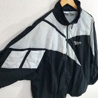 リーボック(Reebok)の名作 ヴェトモン柄 ♪ 90s リーボック ナイロンジャケット L 黒(ナイロンジャケット)