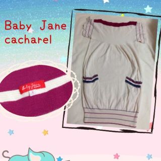 キャシャレル(cacharel)のBabyJane白ニットワンピ(ミニワンピース)