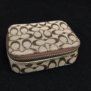 コーチ(COACH)のコーチ シグネチャー 金レザー×キャンバス リップケース ミニバニティ(ポーチ)