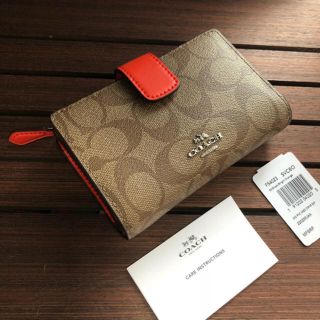 コーチ(COACH)のCOACH コーチ 折り財布 ブライトオレンジ  シグネチャーカーキ(財布)