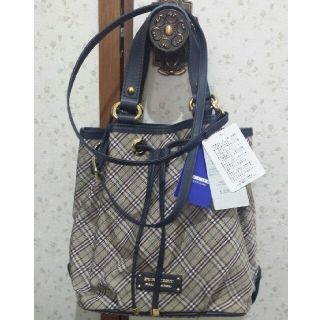 バーバリーブルーレーベル(BURBERRY BLUE LABEL)のバーバリーブルーレーベル　巾着型手提げショルダー　チェック柄　新品タグ付き(ショルダーバッグ)