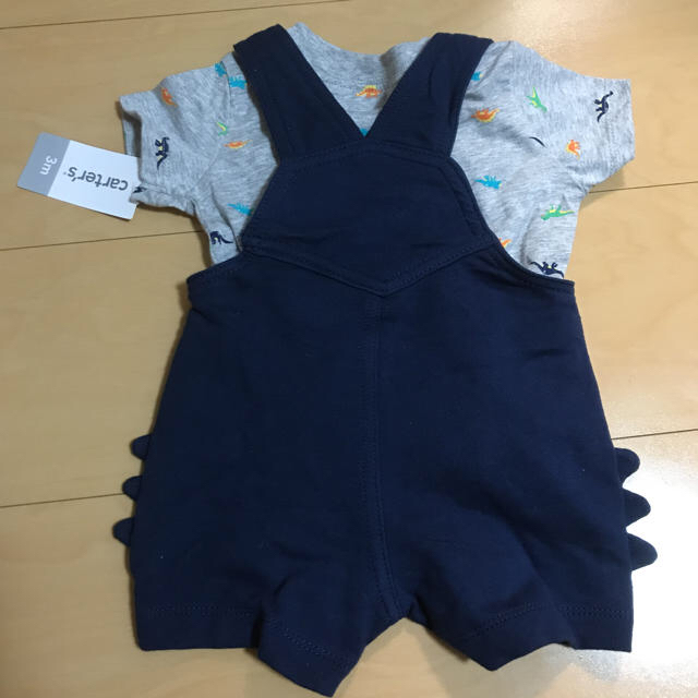 carter's(カーターズ)のcarters 恐竜ロンパース オーバーオール 新品  キッズ/ベビー/マタニティのベビー服(~85cm)(ロンパース)の商品写真