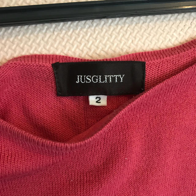 JUSGLITTY(ジャスグリッティー)の美品 ジャスグリッティー  ピンク フレアニット レディースのトップス(カットソー(半袖/袖なし))の商品写真