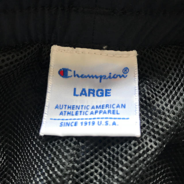 Champion(チャンピオン)のタグ付き新品未使用Champion ナイロンジャージ パンツ メンズのパンツ(ワークパンツ/カーゴパンツ)の商品写真