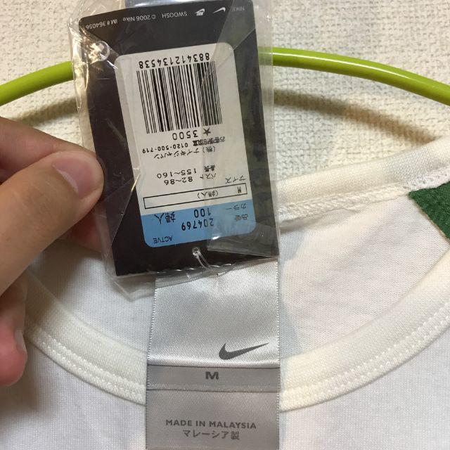 NIKE(ナイキ)の【新品】NIKE ロンT 白 緑 メタリック Mサイズ レディース レディースのトップス(Tシャツ(長袖/七分))の商品写真