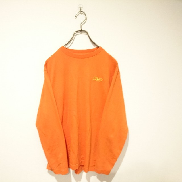 Reebok(リーボック)のReebok リーボック ワンポイントロゴロンT 長袖カットソー オレンジ メンズのトップス(Tシャツ/カットソー(七分/長袖))の商品写真