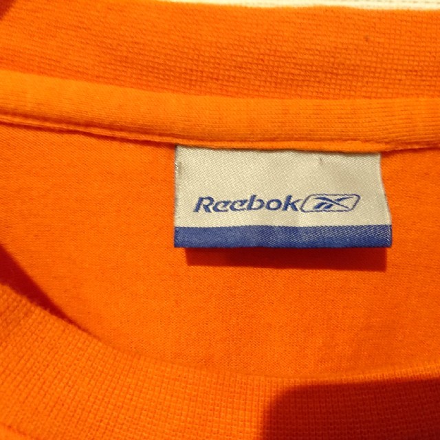 Reebok(リーボック)のReebok リーボック ワンポイントロゴロンT 長袖カットソー オレンジ メンズのトップス(Tシャツ/カットソー(七分/長袖))の商品写真