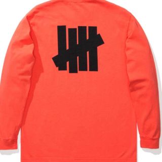 アンディフィーテッド(UNDEFEATED)のundefeated ロンT オレンジ Lサイズ (Tシャツ/カットソー(七分/長袖))