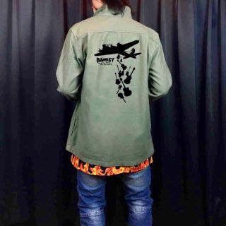 エイソス(asos)の新品 asos エイソス BANKSY バンクシー グラフィティ 戦闘機 楽器 (ミリタリージャケット)