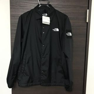 ザノースフェイス(THE NORTH FACE)のノースフェイス　コーチジャケット　サイズＬ 黒　　品番　NP21836 試着のみ(ナイロンジャケット)