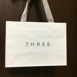 スリー(THREE)のTHREE  ショッパー 紙袋(ショップ袋)