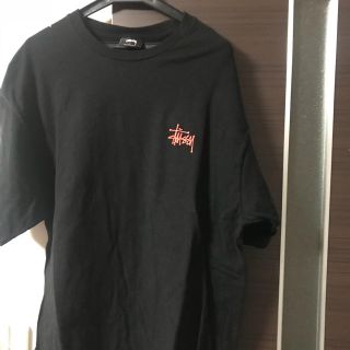 ステューシー(STUSSY)のTシャツ stussy 定番ロゴ 黒とオレンジ(Tシャツ/カットソー(半袖/袖なし))