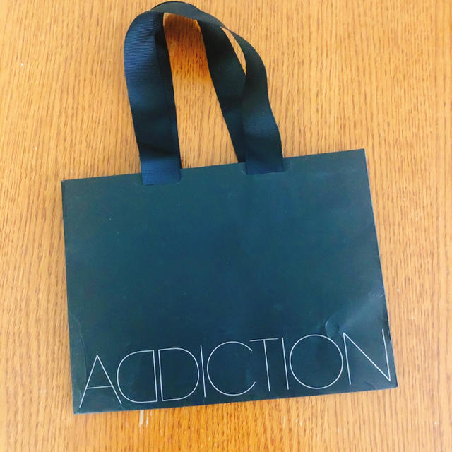 ADDICTION(アディクション)のADDICTION アディクション 紙袋 レディースのバッグ(ショップ袋)の商品写真