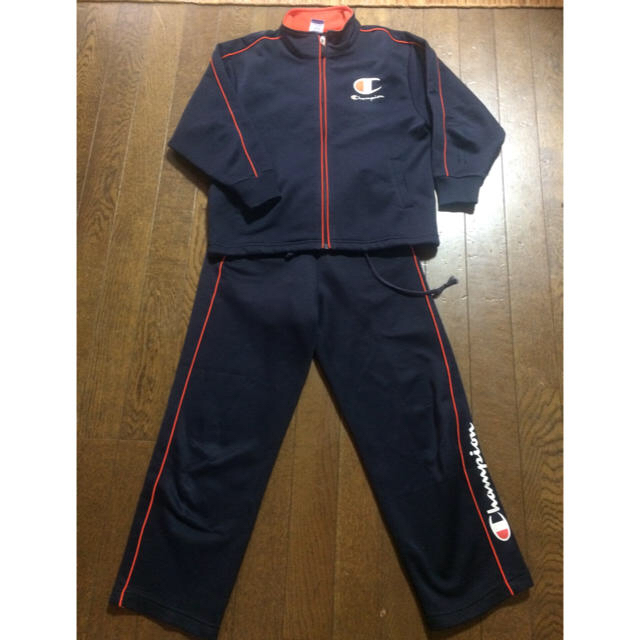 Champion(チャンピオン)の中古チャンピオンジャージ上下セット130champion紺オレンジ運動着上着 キッズ/ベビー/マタニティのキッズ服男の子用(90cm~)(その他)の商品写真