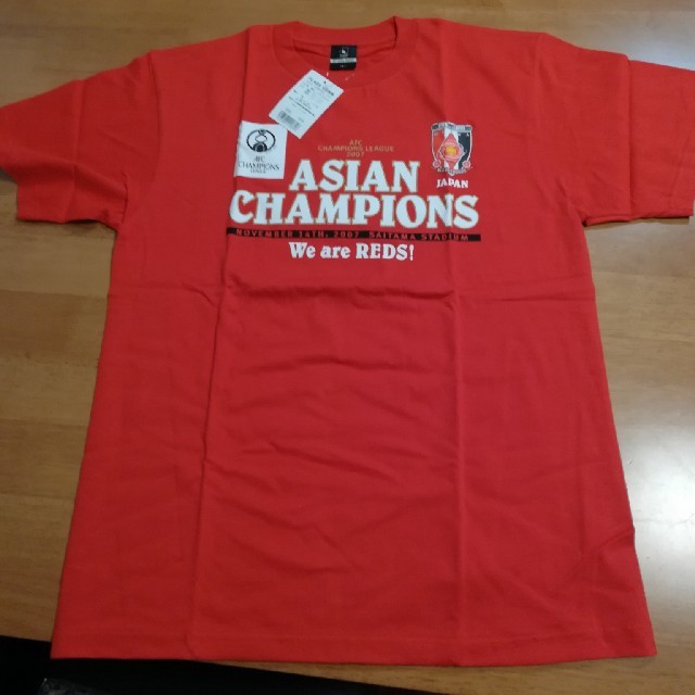 浦和レッズ　2007年ASIAN Chanpions Tシャツ スポーツ/アウトドアのサッカー/フットサル(応援グッズ)の商品写真