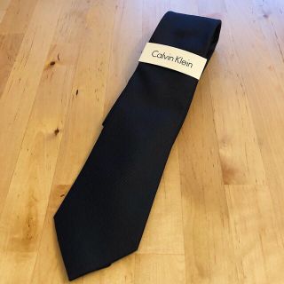 カルバンクライン(Calvin Klein)の【新品】ネクタイ（ブラック/無地)(ネクタイ)