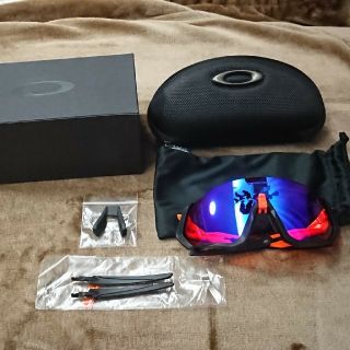 オークリー(Oakley)のオークリー フライトジャケット プリズムトレイル ブラック・オレンジ (ウエア)