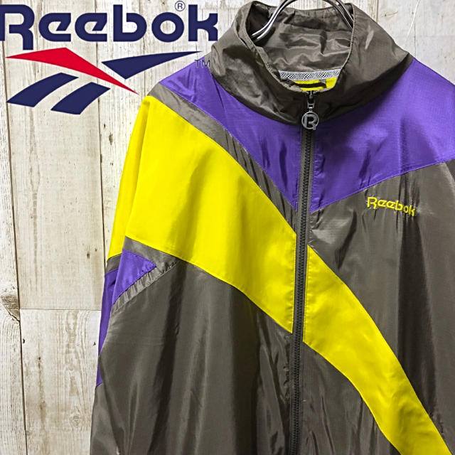 Reebok(リーボック)の古着 Reebok リーボック ベクター ビックロゴ  デカロゴ  L ナイロン メンズのジャケット/アウター(ナイロンジャケット)の商品写真