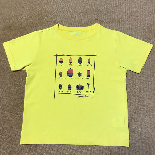 mont bell(モンベル)のモンベル 黄色 どんぐりTシャツ 120 イエロー キッズ/ベビー/マタニティのキッズ服男の子用(90cm~)(Tシャツ/カットソー)の商品写真