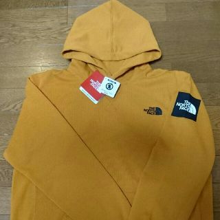 ザノースフェイス(THE NORTH FACE)のノースフェイス スクエアロゴフーディー NT11953 M インカゴールド IG(パーカー)