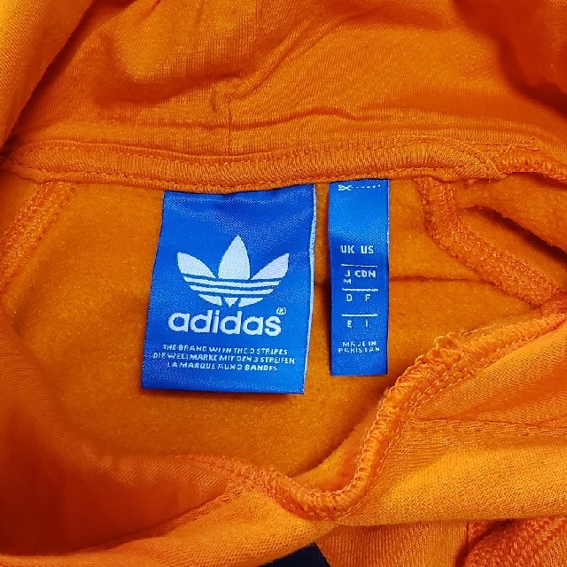 adidas(アディダス)のadidas裏起毛パーカーオレンジ メンズのトップス(パーカー)の商品写真