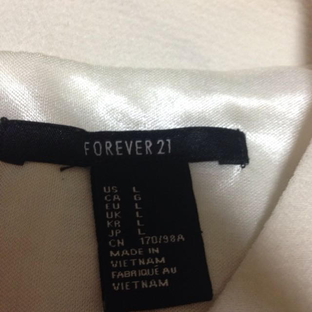 FOREVER 21(フォーエバートゥエンティーワン)のホワイト♡ペプラムトップス レディースのトップス(カットソー(半袖/袖なし))の商品写真