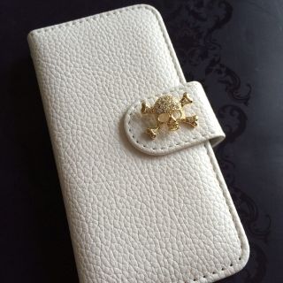 スワロフスキー(SWAROVSKI)のドクロ高級レザー手帳型スマホケース(モバイルケース/カバー)