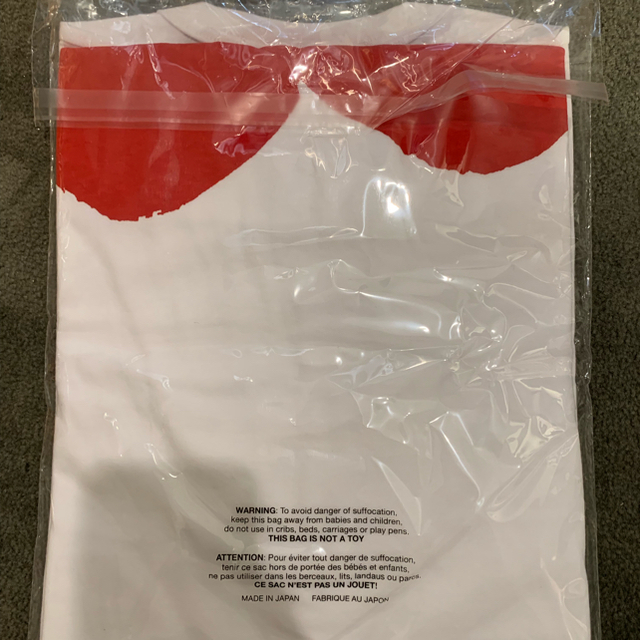 COMME des GARCONS(コムデギャルソン)のPLAYギャルソン メンズ 赤ハートハーフプリントT XL メンズのトップス(Tシャツ/カットソー(半袖/袖なし))の商品写真