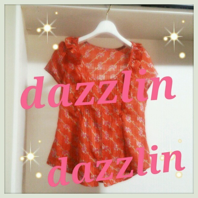 dazzlin(ダズリン)のdazzlin夏オレンジ花柄トップス レディースのトップス(シャツ/ブラウス(半袖/袖なし))の商品写真