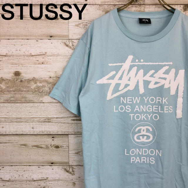 STUSSY(ステューシー)のSTUSSY(ステューシー) ワールドツアー Tシャツ M ロゴ 水色 メンズのトップス(Tシャツ/カットソー(半袖/袖なし))の商品写真