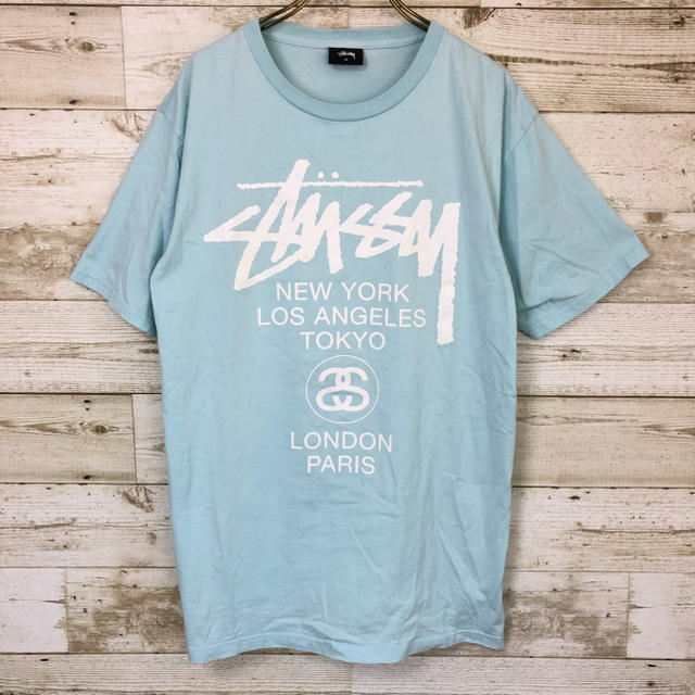 STUSSY(ステューシー)のSTUSSY(ステューシー) ワールドツアー Tシャツ M ロゴ 水色 メンズのトップス(Tシャツ/カットソー(半袖/袖なし))の商品写真