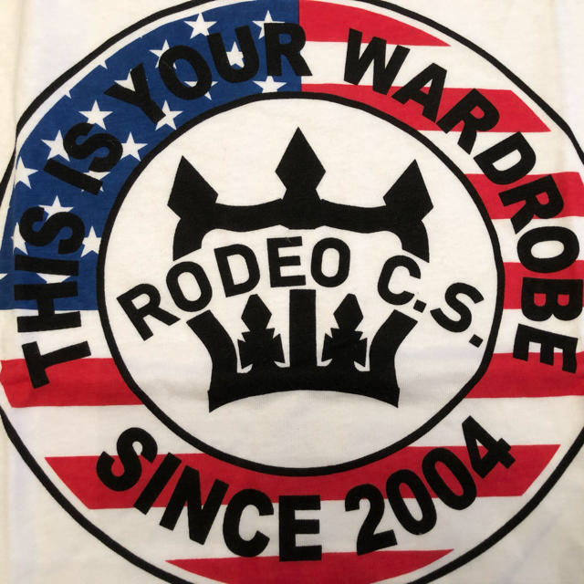 RODEO CROWNS WIDE BOWL(ロデオクラウンズワイドボウル)のロデオクラウンズ ワイドボウル サークルロゴ T アメリカンフラッグ L レディースのトップス(Tシャツ(半袖/袖なし))の商品写真