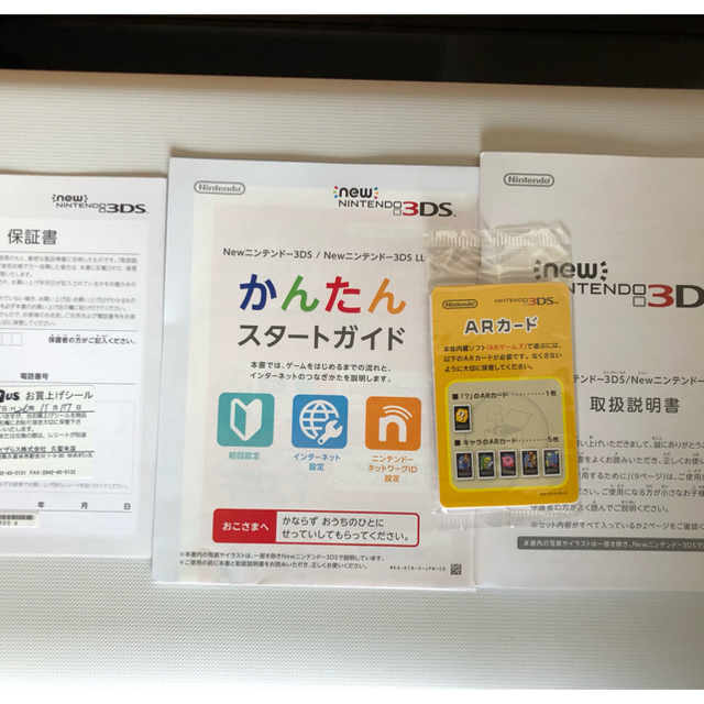 ニンテンドー3DS(ニンテンドー3DS)のnew3DS ブラック きせかえプレート（イエロー）のおまけ付き エンタメ/ホビーのゲームソフト/ゲーム機本体(携帯用ゲーム機本体)の商品写真