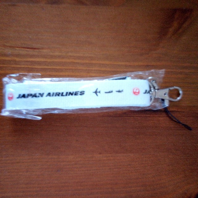 JAL(日本航空)(ジャル(ニホンコウクウ))のJALネックストラップ　白 スマホ/家電/カメラのスマホアクセサリー(ストラップ/イヤホンジャック)の商品写真