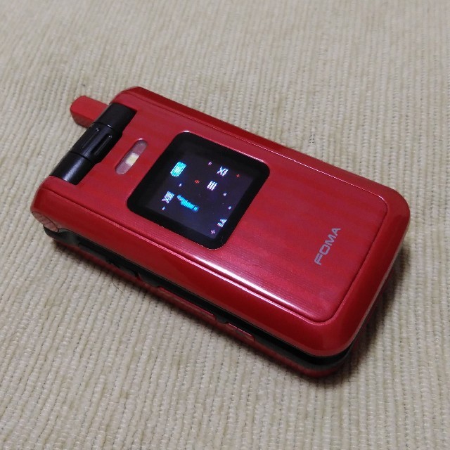 NTTdocomo(エヌティティドコモ)のdocomo　FOMA  L600i docomo充電器付き スマホ/家電/カメラのスマートフォン/携帯電話(携帯電話本体)の商品写真