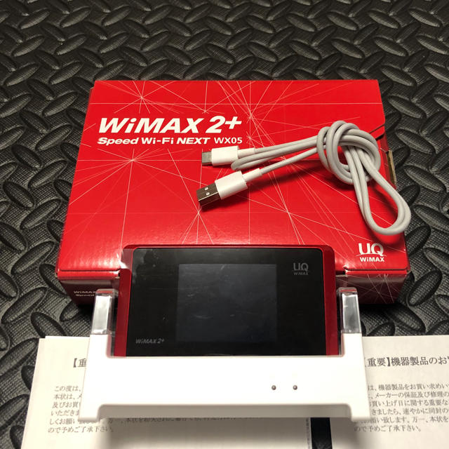 Speed Wi-Fi NEXT WX05 レッド クレードル付き スマホ/家電/カメラのスマートフォン/携帯電話(その他)の商品写真