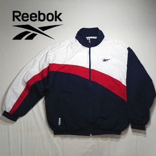 リーボック(Reebok)のREEBOK　リーボック　アシンメトリー　マルチカラー　ナイロンジャケット(ナイロンジャケット)