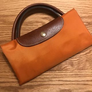 ロンシャン(LONGCHAMP)のLongchampロンシャン 折り畳みトラベルトートバッグオレンジ(トートバッグ)