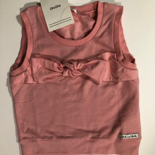 ベベ(BeBe)の新品タグ付き BEBE 可愛いリボン飾り付ききれいなピンクのカットソー(Tシャツ/カットソー)