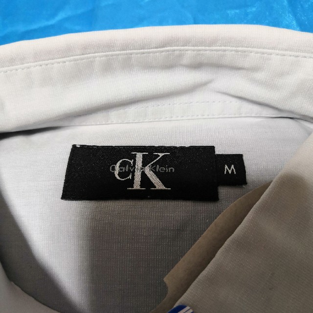 Calvin Klein(カルバンクライン)のカルバンクライン グレーM メンズのトップス(シャツ)の商品写真