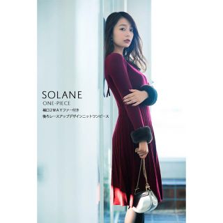 トッコ(tocco)の袖口2WAYファー付き後ろレースアップデザインニットワンピース 【solane　(ひざ丈ワンピース)