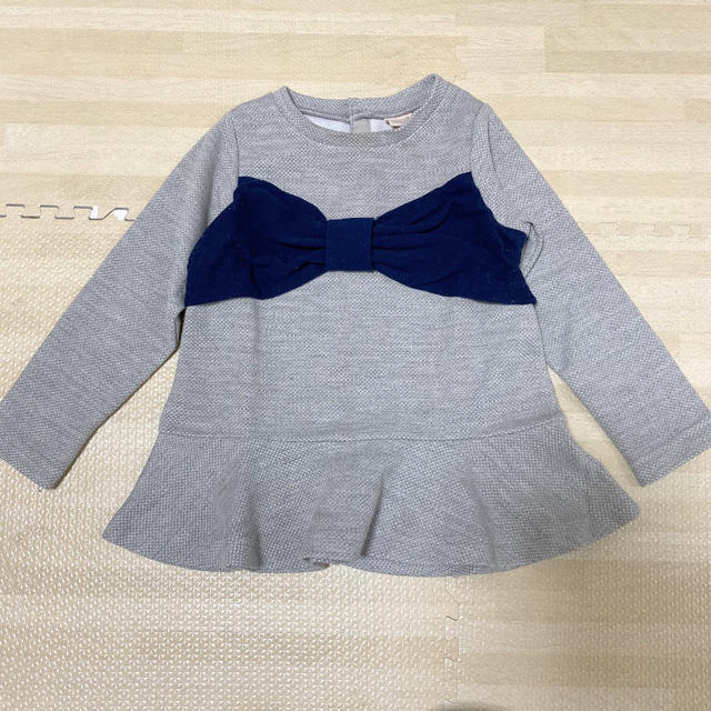 petit main(プティマイン)のpetit main リボン ペプラム トップス  キッズ/ベビー/マタニティのキッズ服女の子用(90cm~)(Tシャツ/カットソー)の商品写真